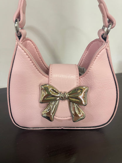 Bolso de niña en rosa, con lazo