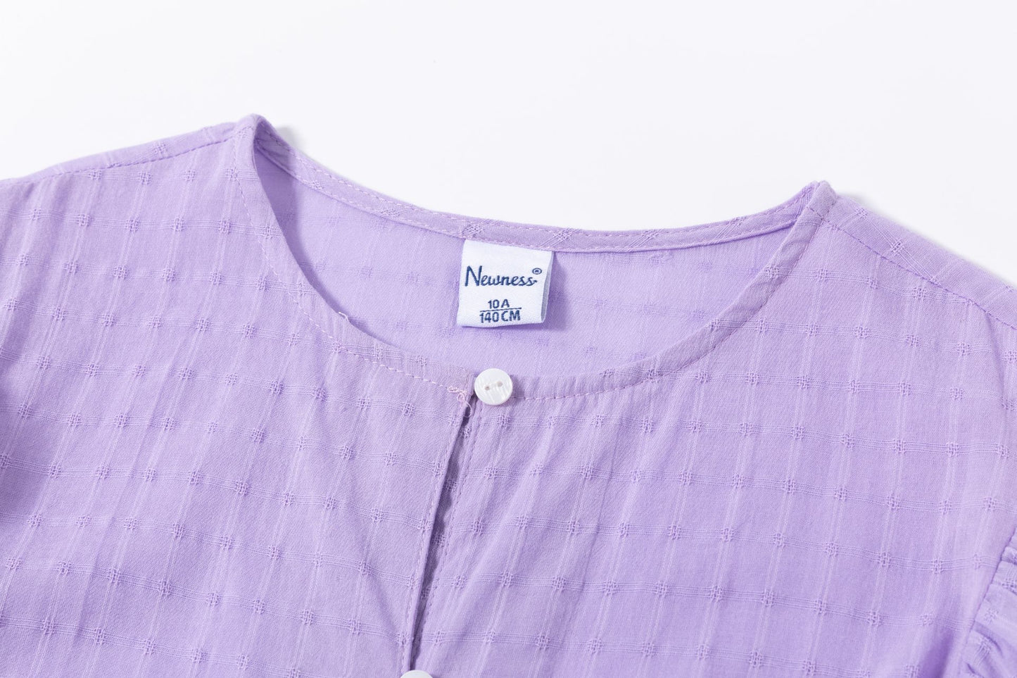 Blusón de niña en morado en color morado - Newness - Detalle 2 - Moda Infantil Chicle