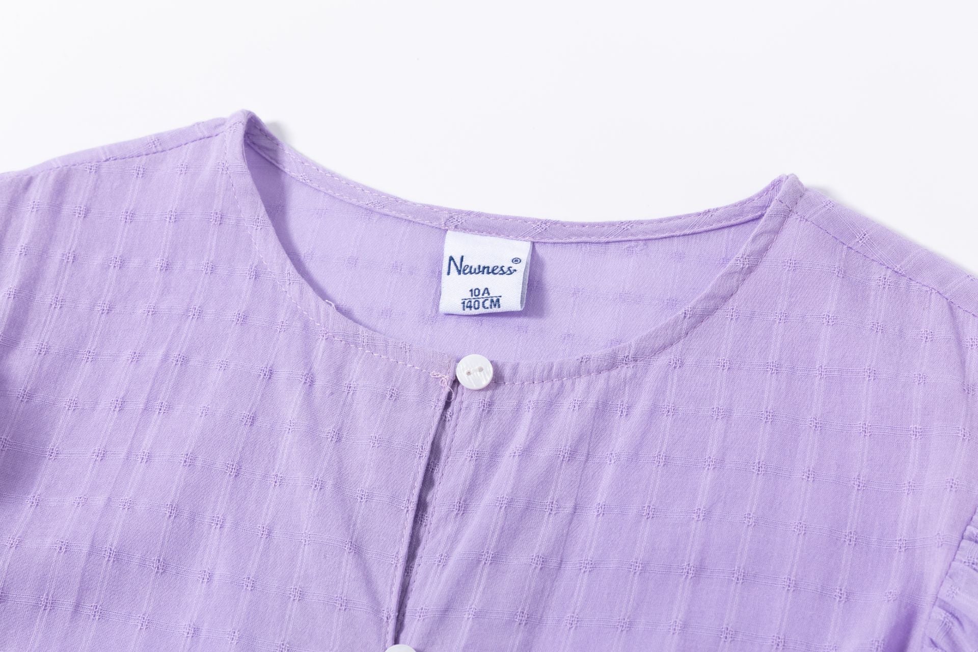Blusón de niña en morado en color morado - Newness - Detalle 2 - Moda Infantil Chicle