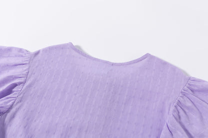 Blusón de niña en morado en color morado - Newness - Detalle 8 - Moda Infantil Chicle